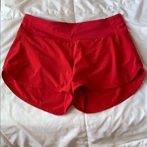 Red lululemon “speed up” shorts long